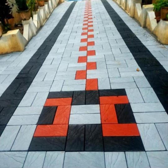 Pathway with black borders and a red centre pattern