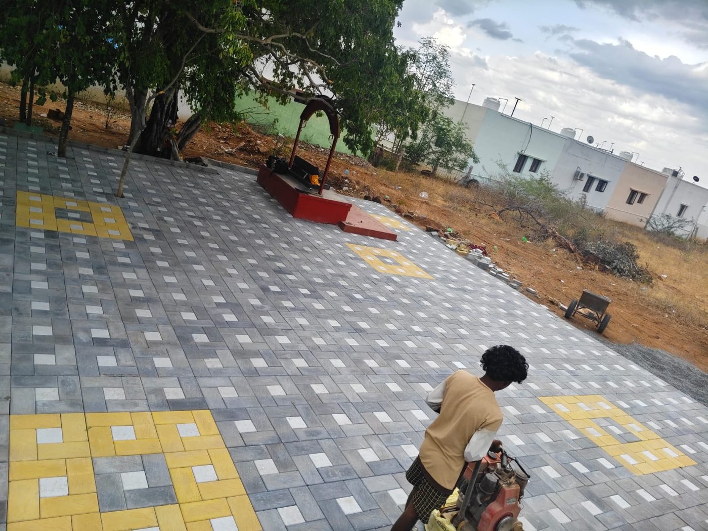 Park area with grey, white and yellow square tiles